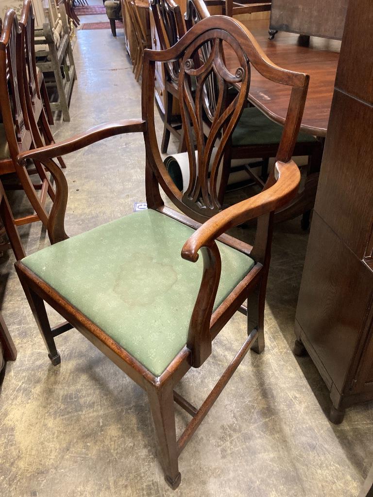 A set of eight George III mahogany shield back dining chairs (two with arms)